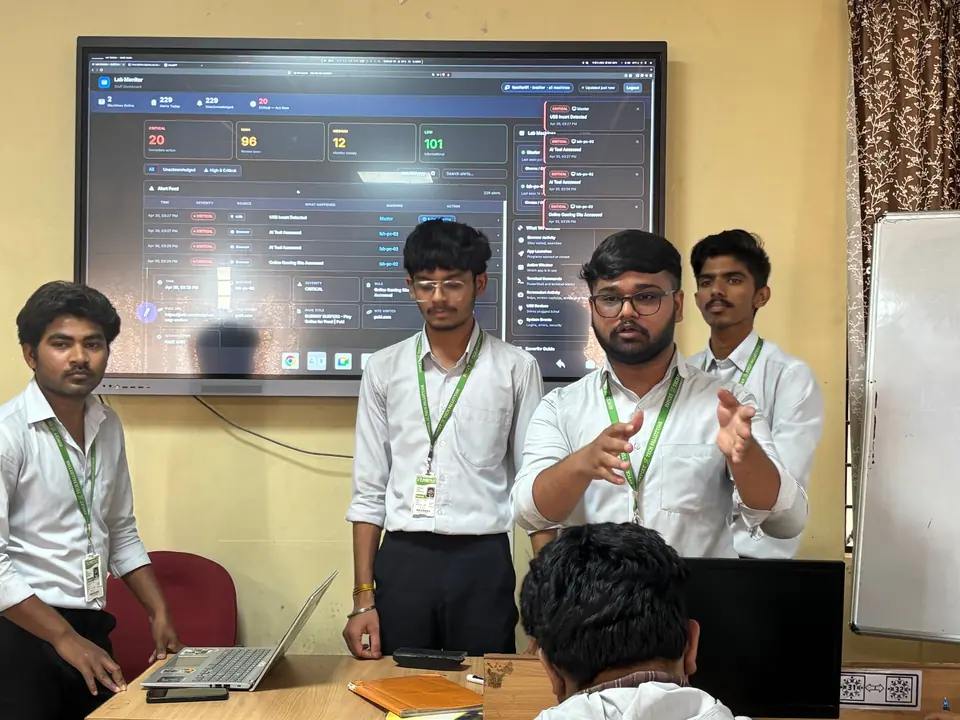 Anshul and teammates presenting a security dashboard on a large screen