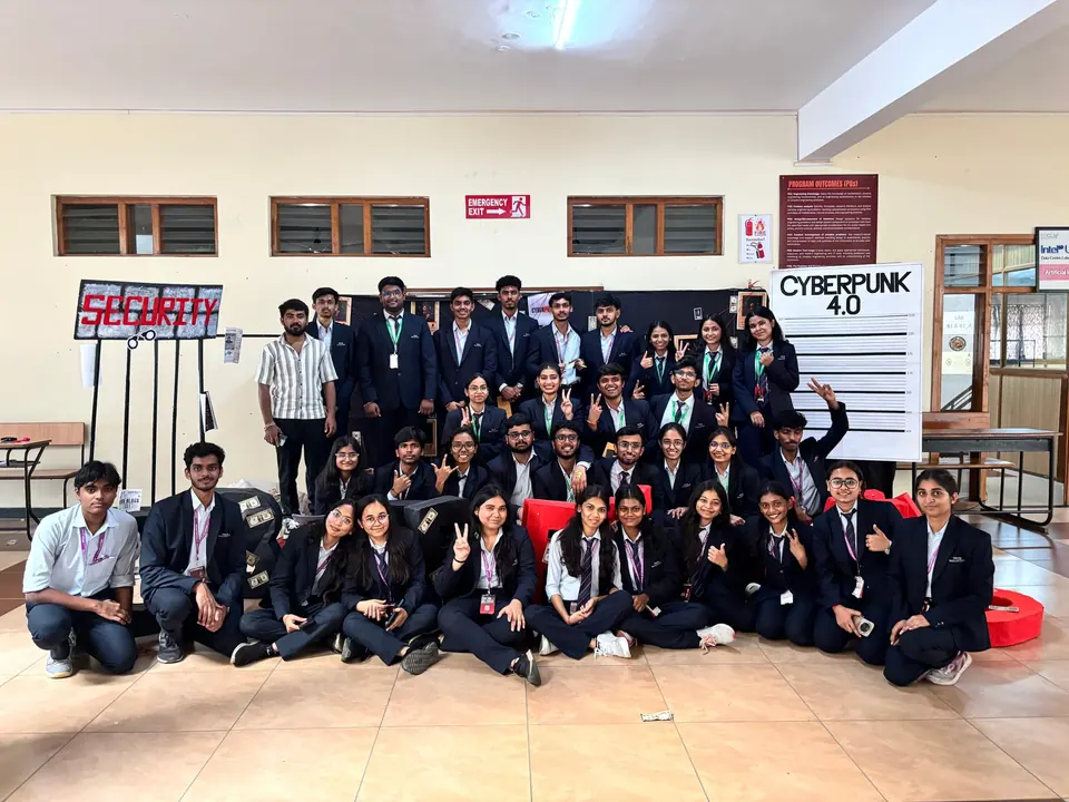 Large group photo of students in front of a Cyberpunk 4.0 banner