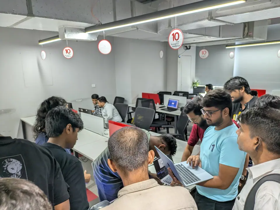 Attendees with laptops at a Hack The Box meetup in Mumbai